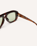 Inside view of chunky acetate frame in an aviator shape. Tortoise frame with green lenses.
