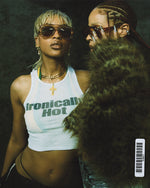 Model wearing chunky acetate frame in an aviator shape. Peach frame with brown lenses.
