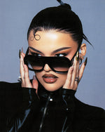 Model wearing stylish acetate sunglasses with a modern design, featuring a sleek black frame and subtly faded black lens.