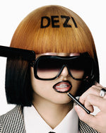 Model wearing stylish acetate sunglasses with a modern design, featuring a sleek black frame and subtly faded black lens.